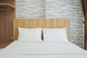 Comfort and Cozy 1BR at Tree Park City BSD Apartment By Travelio